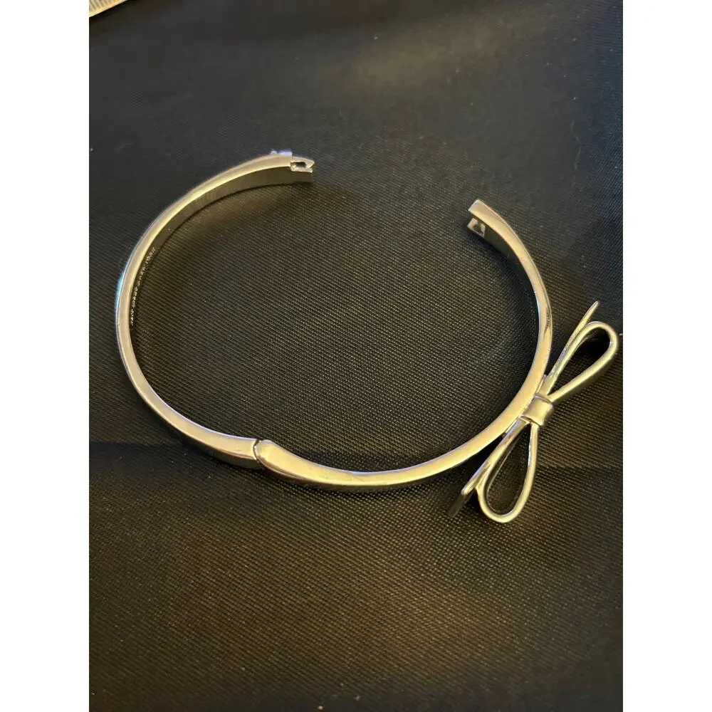 Kate Spade Silver Tone Bow Hinged Bangle Size 7